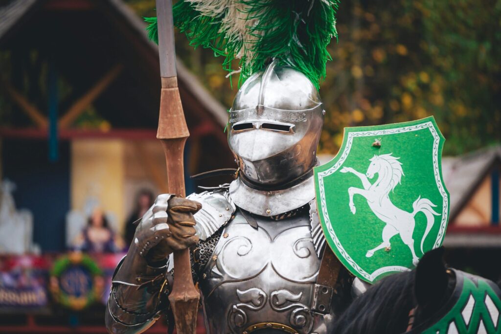 a person in a garment holding a shield and a sword