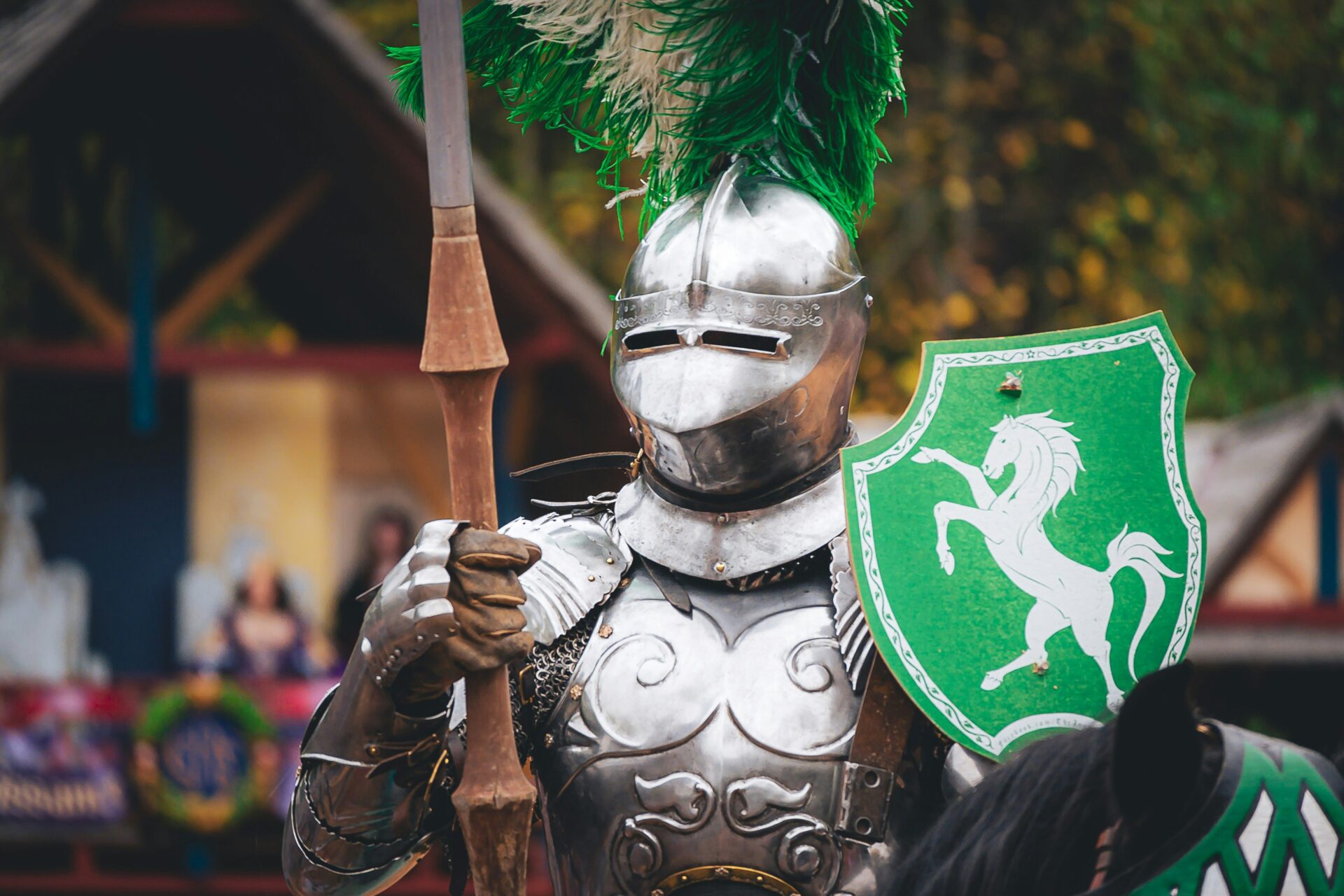a person in a garment holding a shield and a sword